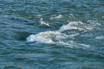 Obraz premium Stones in the water, mountain river on a Sunny day