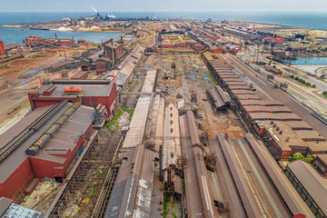Aerial View of Vast Industrial Landscape. Steel Mills and Heavy Industry, Rail Lines, Bridges, Shipping Canal, Harbor, etc.