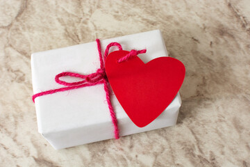 Fototapeta premium Gift box with heart-shaped card.