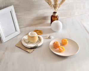 Beauty lifestyle background with Opened Jar of face cream and fresh tangerines.  winter skin care concept