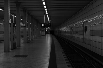 Underground Station in Berlin, Empty platform of a subway station in Berlin, black and white photo