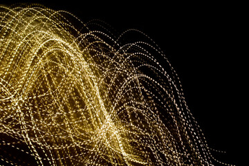 golden dashed lines of lights on black background