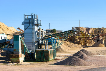 Machinery in a rock quarry to crush and sand the stone.