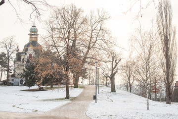 Snowing day on Prague. People walk on Park Letna while tram travel through the city, close to Hradcanska in Prague 6
