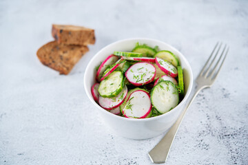 Radish cucumber dill salad in a bowl