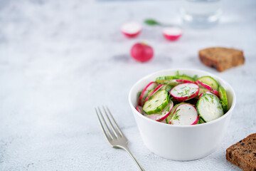 Radish cucumber dill salad in a bowl