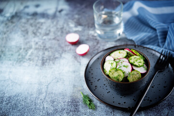 Radish cucumber dill salad in a bowl