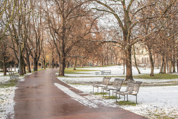 Snowing day on Prague. People walk on Park Letna while tram travel through the city, close to Hradcanska in Prague 6