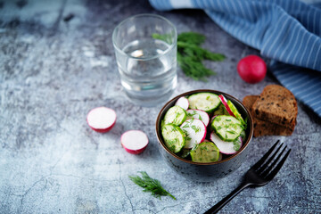 Radish cucumber dill salad in a bowl