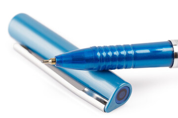 Side view of a blue ballpoint pen, isolated on a white background. Close-up.