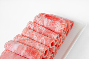 Sliced beef close up for Chinese hot pot. Chinese food.