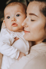 Peaceful loving home atmosphere, baby in mom's arms