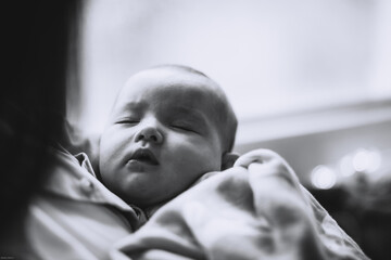 Portrait of a little girl 3 months old from birth, photo at home