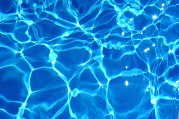 Fototapeta na wymiar Water abstract background, Swimming pool rippled. Surface of blue swimming pool,background of water in swimming pool. Water background blue.