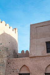 A white dove sitting on the fortification of the Fujairah Fort, United Arab Emirates