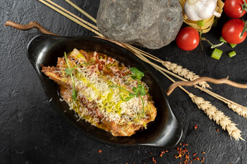 Lasagna bolognese. A hot main course of pasta, minced meat, vegetables, béchamel sauce and cheese.