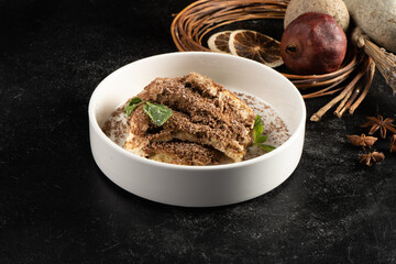 Tiramisu with cocoa and vanilla biscuit. Classic sweet dessert.