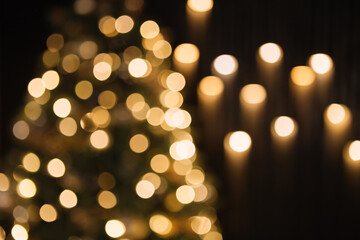 Obraz premium christmas lights in blur, bokeh on a dark background, copy space