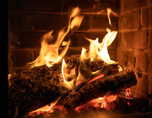 fire in a heated stone fireplace, horizontal
