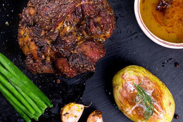 roast with herbs on a black stone © Patrycja