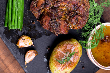  roast with herbs on a black stone © Patrycja