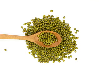 Dry green beans on white background. Organic raw green beans mungo (Vigna radiata) in wooden spoon...