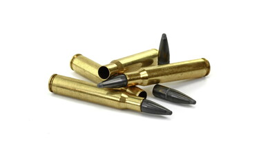 A rifle bullet, empty shell, gunpowder on white background. Hunting ammunition isolated on white.