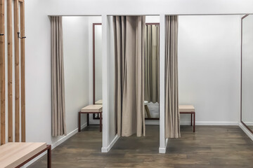 A row of dressing booths for trying on clothes