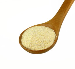 Pile of corn flour in a wooden spoon isolated on white background.