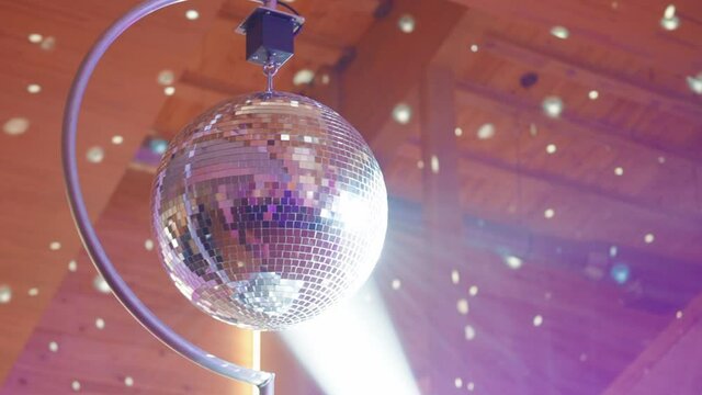 Silver Disco ball under the ceiling in the restaurant