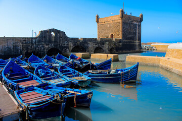 Fototapeta na wymiar Blue wooden fishing boats in Essaouira port, Morroco