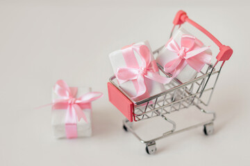 Pink gift box in basket, holiday concept