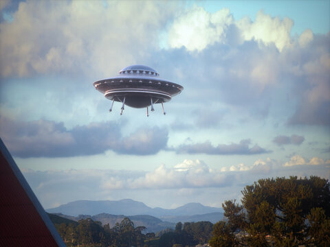 Unidentified flying object flying over the city. Alien spaceship in the shape of a disc made of metallic material. Clipping path included.