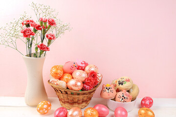 Happy Easter concept, greeting card, background, spring composition.Decorated pink Easter eggs and sweets on a rustic background, place for text, banner for screen