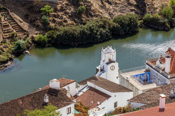 Naklejka premium old town of Mertola with Guadiana river and clock tower, Alentejo, Portugal