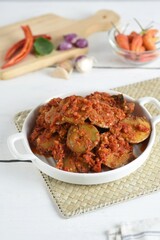 jengkol balado is a traditional indonesian food ,made from jengkol seeds or dogfruit fruit cooked with balado or spicy chilli sauce.sometimes called sambal jengkol