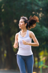 Young woman running in a park