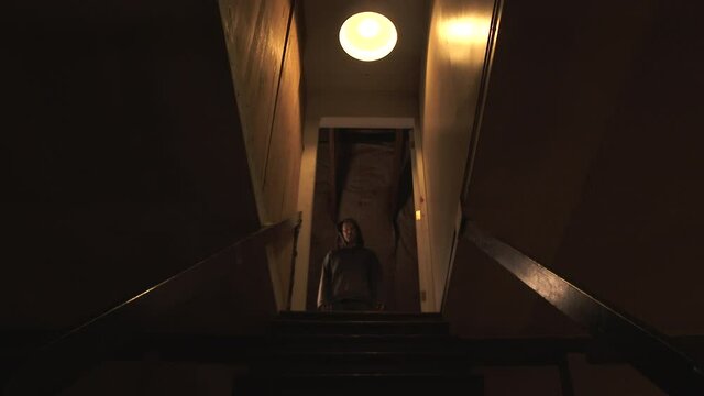 Evil Man Runs Down Staircase Attacking Viewer