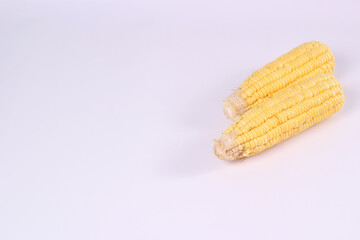 fresh corn on the table isolated white background