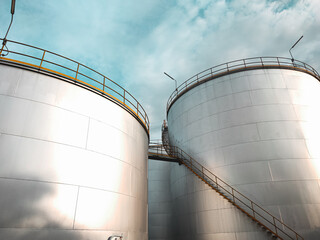 Oil storage tank  In industrial areas.  Crude oil storage plant  For export.  Palm oil factories in Asia. The atmosphere at sunset.  Within the industrial plant
