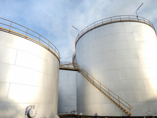 Oil storage tank In industrial areas. Crude oil storage plant For export. Palm oil factories in Asia. The atmosphere at sunset. Within the industrial plant