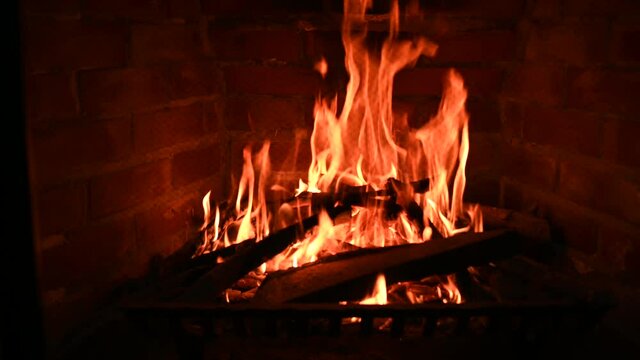 Close up view of a fire burning inside a fireplace