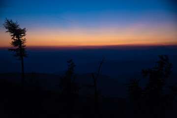 Obraz premium Impressive and scenic view of colorful and dramatic sunset, from a high peak of Old mountain, a view to surrounding peaks and highlands as midzor and other peaks at summer evening. Old Mountain,Serbia