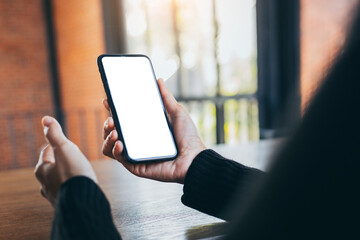 cell phone blank white screen mockup.woman hand holding texting using mobile on desk at office.background empty space for advertise.work people contact marketing business,technology