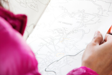 Close-up Of Woman Holding Map