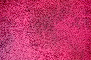 Pink leather texture imperfect with some black dots at middle