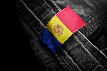Tag on dark clothing in the form of the flag of the Andorra