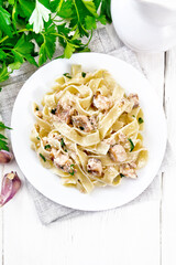 Pasta with salmon and cream on light board top