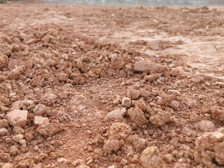 Laterite soil, red soil is used to fill the area for construction preparation. Nature background.