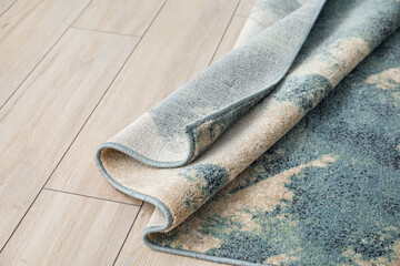 Beautiful soft carpet on wooden floor